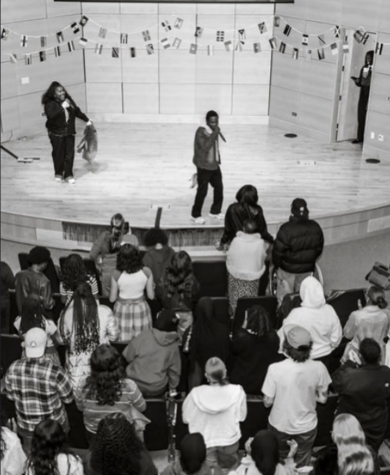 A congregation standing before the stage during A Call to Arise
